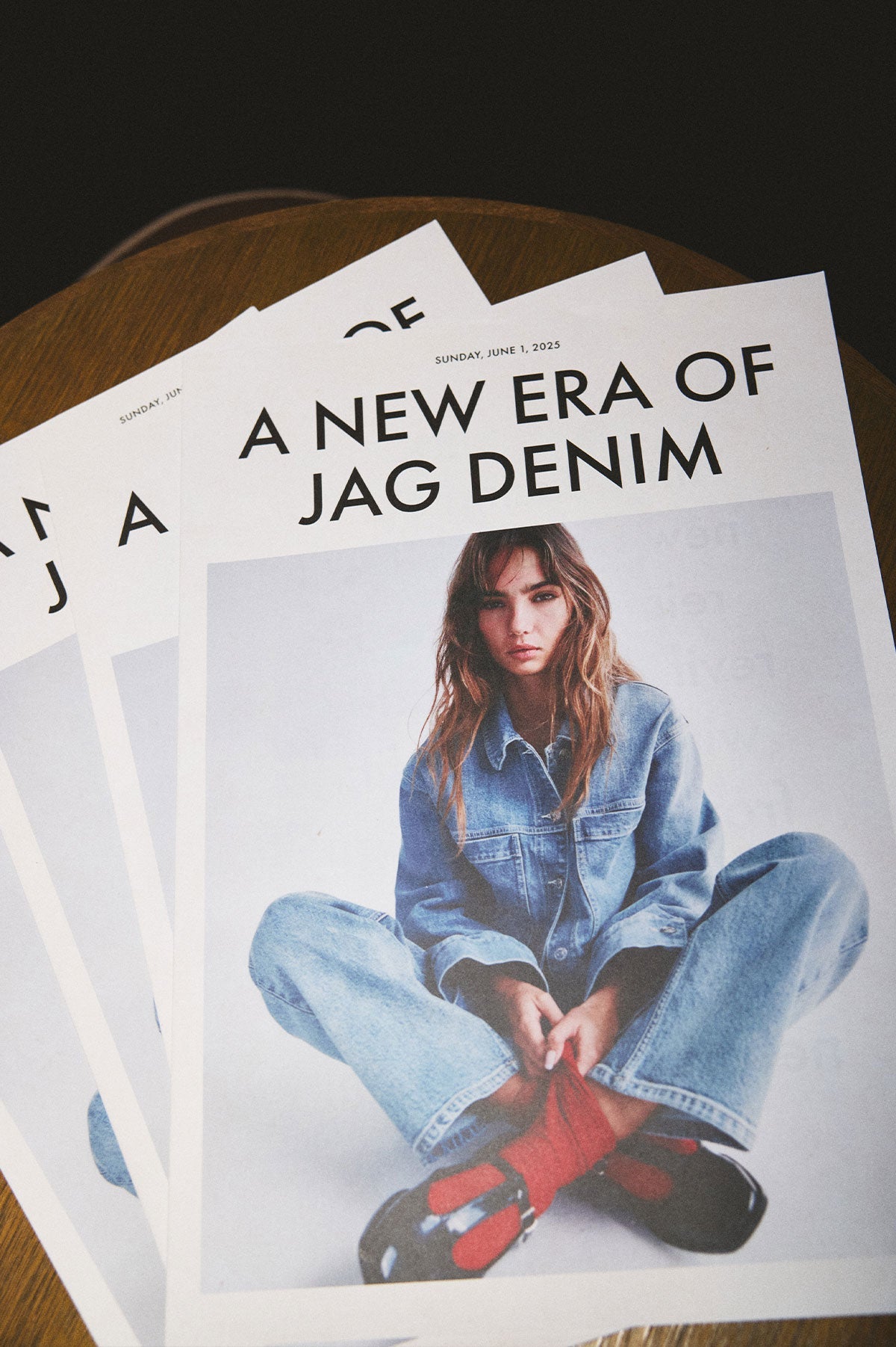 Image of newspaper with JAG denim on front